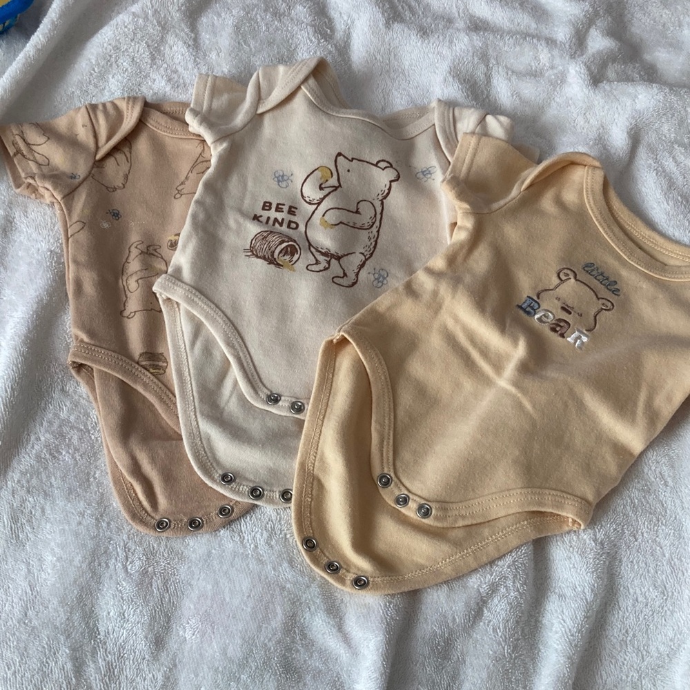 3 fo $16 Disney Beige and Cream Baby Bodysuit Trio